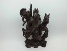 A Chinese Carved Hardwood Group of Samurai and attendant, mounted on horseback, 14" high