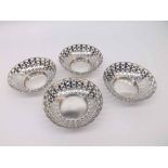 A set of four Edwardian Circular Bon-Bon Dishes, pierced with bands of oval designs, wavy rims, 9