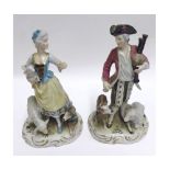 A pair of European Figures modelled as shepherd and shepherdess, each painted in colours (some