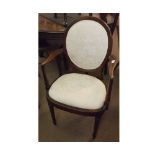 Mahogany Carver Chair, slightly swept arms and bowed apron, raised on tapering cylindrical ring