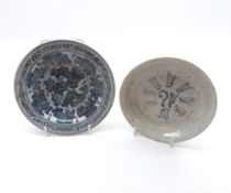 Two Chinese Saucer Dishes, one decorated in underglaze blue with foliage and the other with