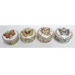 A collection of four Royal Crown Derby Circular Covered Boxes decorated with the "Butterflies of the