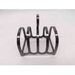 A George VI Toast Rack of five hooped bars with central carrying handle, 8cm x 6cm, well-marked