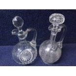 A Mixed Lot comprising: two 19th Century Clear Glass Decanters of onion form, fitted with looped