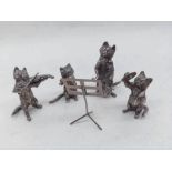 An interesting group of four Elizabeth II cast Silver models of Cats playing Musical Instruments