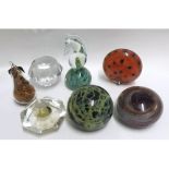 A collection of seven various 20th Century Paperweights, including a Royal Mint example inset with a