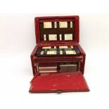 Hinged red leather covered case containing Rubicon Bezique markers, produced by Mudies, 15