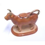 A Staffordshire style Cow Creamer, decorated throughout in iron red and gilded detail, 5" high