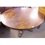 Large circular Oak pedestal Dining Table with heavy top and raised on a block support terminating in