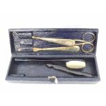 An Asprey of London Leather Cased Travelling Set, comprising: silver gilt handled Button Hook and