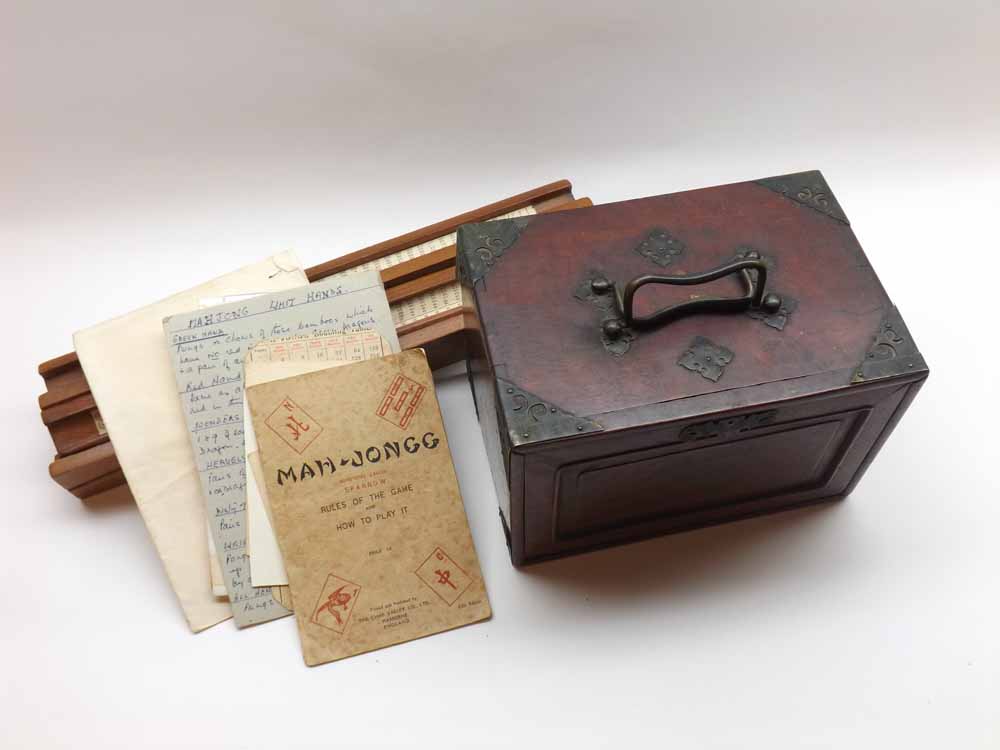 A 20th Century Mah Jong set, contained in a five-drawer wooden cabinet, together with four wooden