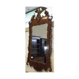 A Chippendale style Mahogany Wall Mirror, crested with a parcel gilded Ho Ho bird, scrolls and