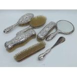 A Mixed Lot of embossed Silver Backed Dressing Table Wares, comprising, pair of hand brushes and