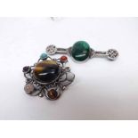 A Celtic styled white metal Bar Brooch with oval Malachite panel to centre, 7cms long together