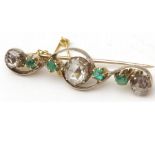 An early 20th Century unmarked precious metal Bar Brooch, of scroll design featuring a centre Rose