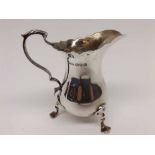 George V small baluster Silver Cream Jug with looped handle and three swept feet, hallmarked for