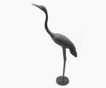 20th Century Bronzed finish model of a Crane raised on a circular base, unsigned, approx 20” high