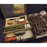 Boxed Hornby 0 gauge tinplate clockwork train set comprising LNER green locomotive and tender, three