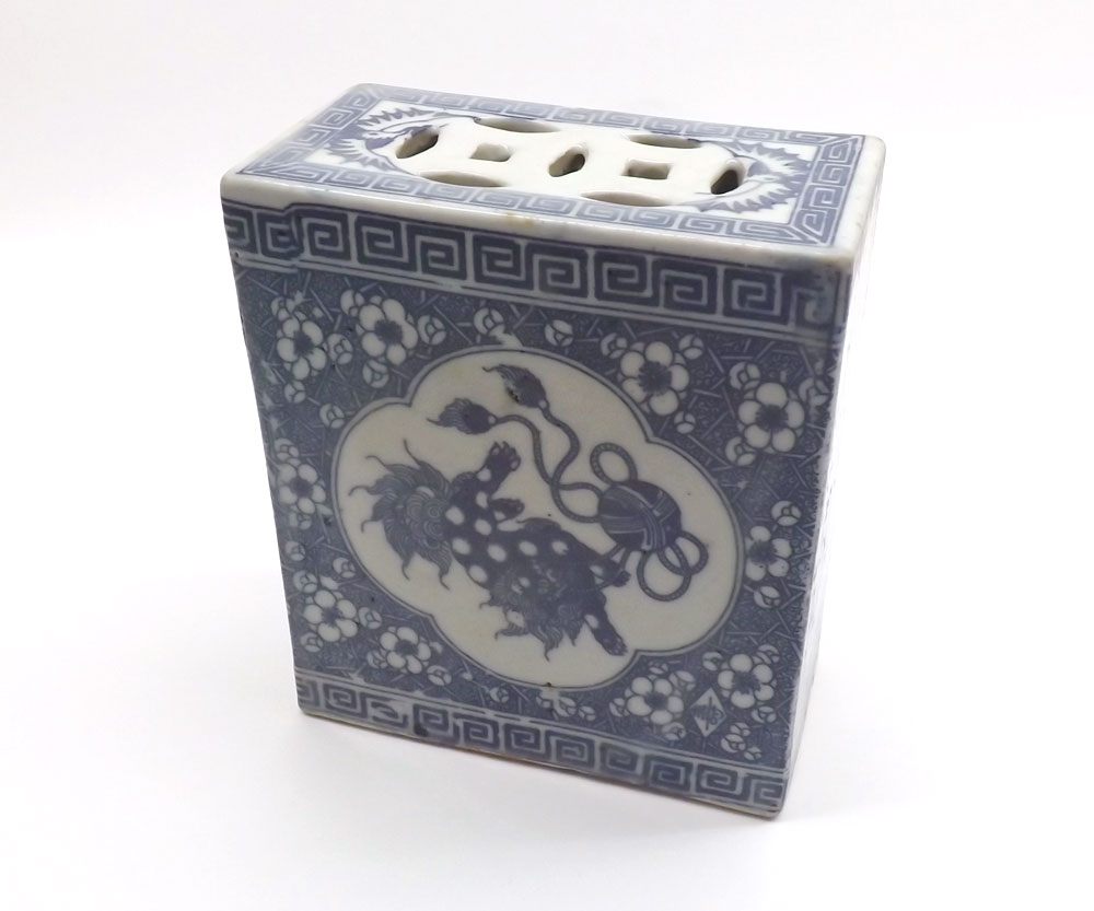 A Chinese Flower Brick, of rectangular form with pierced top, decorated with panels of Kaolin in