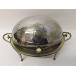 Silver plated oval double handled Warming Dish, with hinged top raised on four tapering legs, 13”