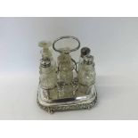 A Victorian Electroplated Cruet Stand of shaped rectangular form, with applied thistle and leaf