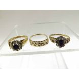 A late 19th Century hallmarked 9ct Gold Ring set with a centre circular dark blue Sapphire