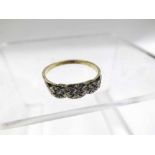 High grade precious metal Ring set with three small Brilliant Cut Diamonds stamped “18ct and