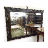 A large Oak Rectangular Wall Mirror with foliate and scroll carved frame, circa late 19th/early 20th