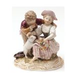 A Meissen Group of two children with dog, young girl clutching a floral wreath in her left hand,