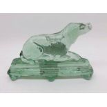 An unusual Green Glass Door Stop, modelled as a reclining retriever dog, 4” high