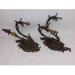 A pair of Victorian Ornate Gilt Metal Two Branch Wall Sconces, elaborately decorated with scrolls