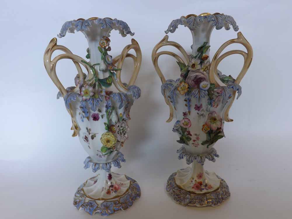 A pair of decorative European two-handled urn-shaped Vases, encrusted throughout with flowers and