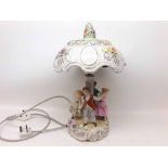 A modern Dresden Table Lamp with domed shade, encrusted with flowers and the base applied with