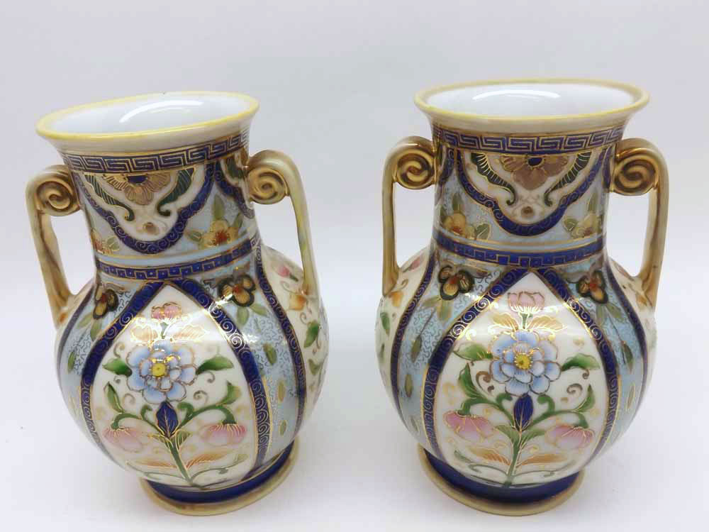 A pair of Noritake two-handled Baluster Vases decorated in colours with compartmentalised design