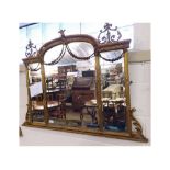 A 19th Century Adam style Overmantel Mirror with arched centre, applied on either side by scroll