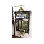 A 19th Century Aesthetic Period Ebonised and Gilded Girandole, crested with a ribbon mask and