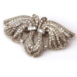 An unmarked precious metal Art Deco style two-part Clip Brooch, of “Wings” design, set throughout