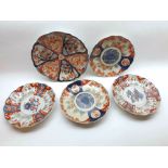A collection of five various Japanese Imari Plates, all typically decorated with compartmentalised
