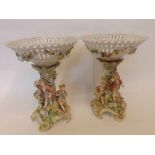 A pair of Plaue Porcelain Centrepieces, each crested with pierced and gilded bowls and raised on