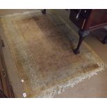 A Caucasian style Wool Rug, large central panel of twining foliage within a multi-gull border, 5’10”