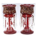 Pair of large Victorian red glass Lustre Vases, decorated with floral sprays and fitted with clear