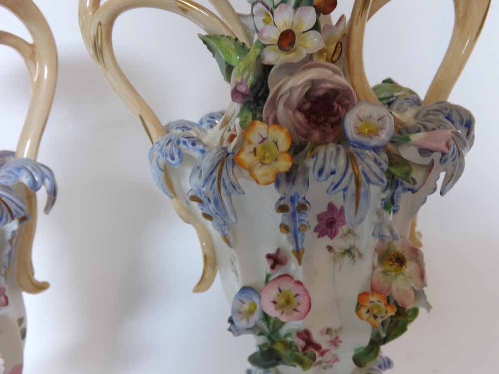 A pair of decorative European two-handled urn-shaped Vases, encrusted throughout with flowers and - Image 2 of 4