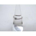 Hallmarked 18ct White Gold single stone Diamond Ring approximately .1ct, cross-over setting
