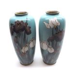 A pair of decorative Oriental Enamelled Baluster Vases, decorated in colours with water foliage on a