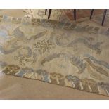 A small Oriental style Wool Rug, decorated with exotic animals and birds etc, mainly beige field,