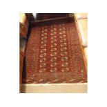 A Caucasian Wool/Silk Mix small Rug, decorated with central panel of small lozenges within a multi-