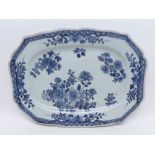 A Nanking Platter, painted in underglaze blue with sprays and sprigs and foliage within a