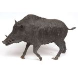 A late 20th Century Bronze Patinated Metal Model of a wild boar, in running pose with flared tusks