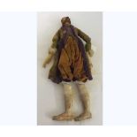 A late 19th Century carved wood and composition figure of a gentleman dressed in original costume (