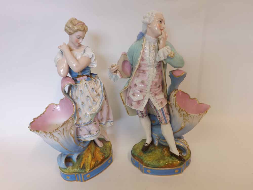 A pair of Dresden Large Figures, of a dandy and his female companion, each in coquettish poses,